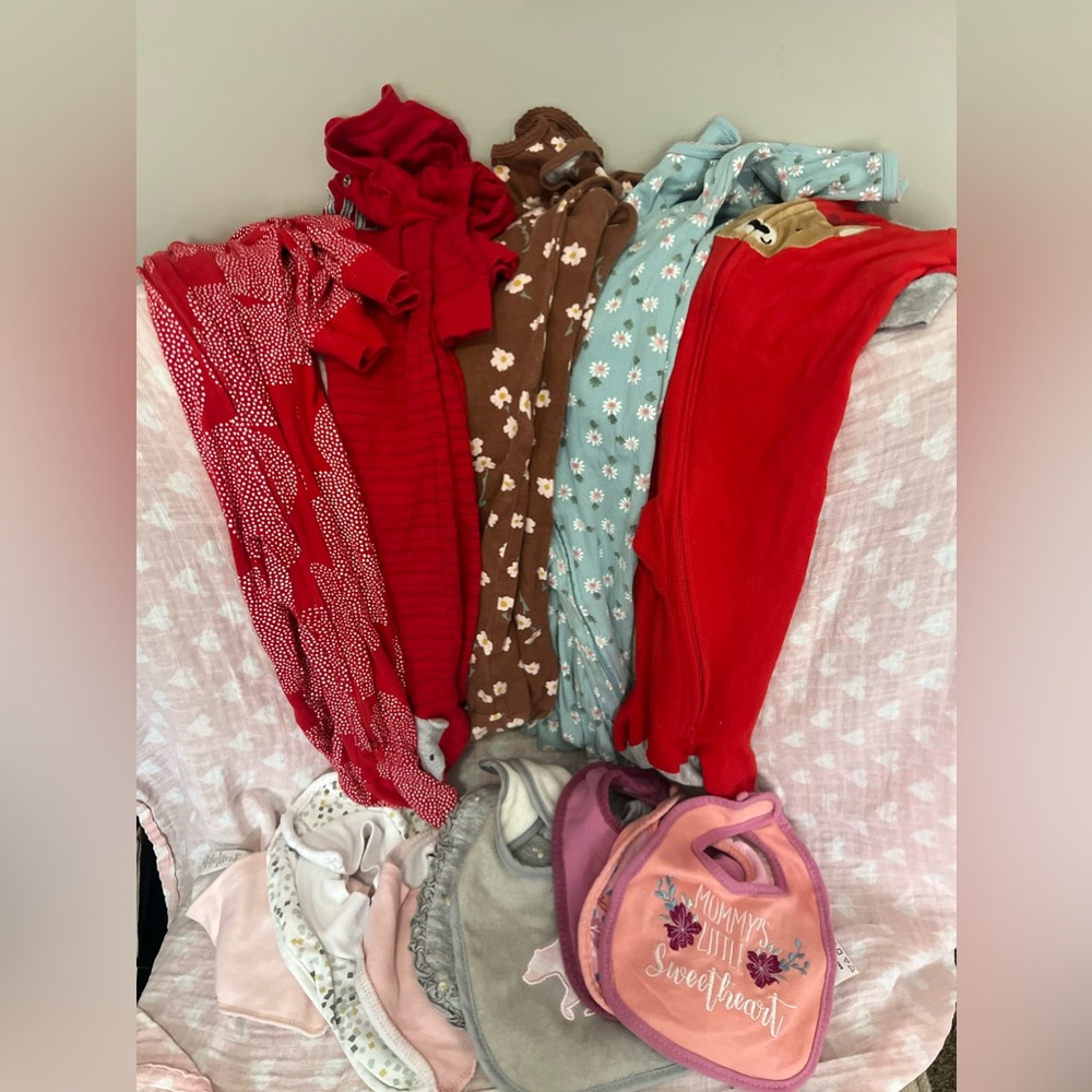 5 Baby Carter’s onesies, 2 hooded jacket, 9 month jumpsuit, and 9 bibs.